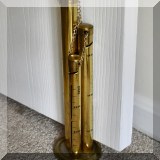 D02. Brass coin sorter doorstop.